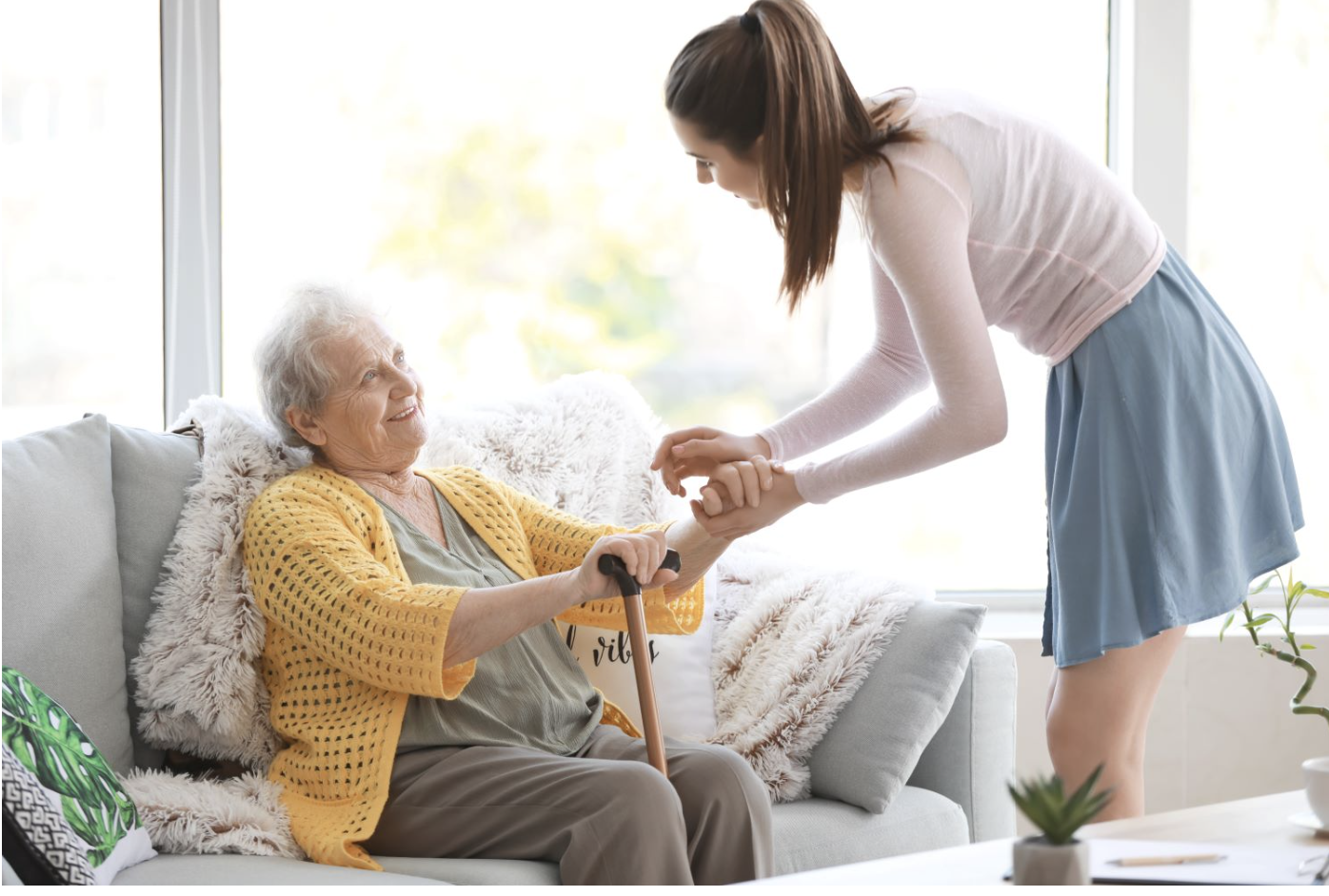 Caregiver assisting elderly resident